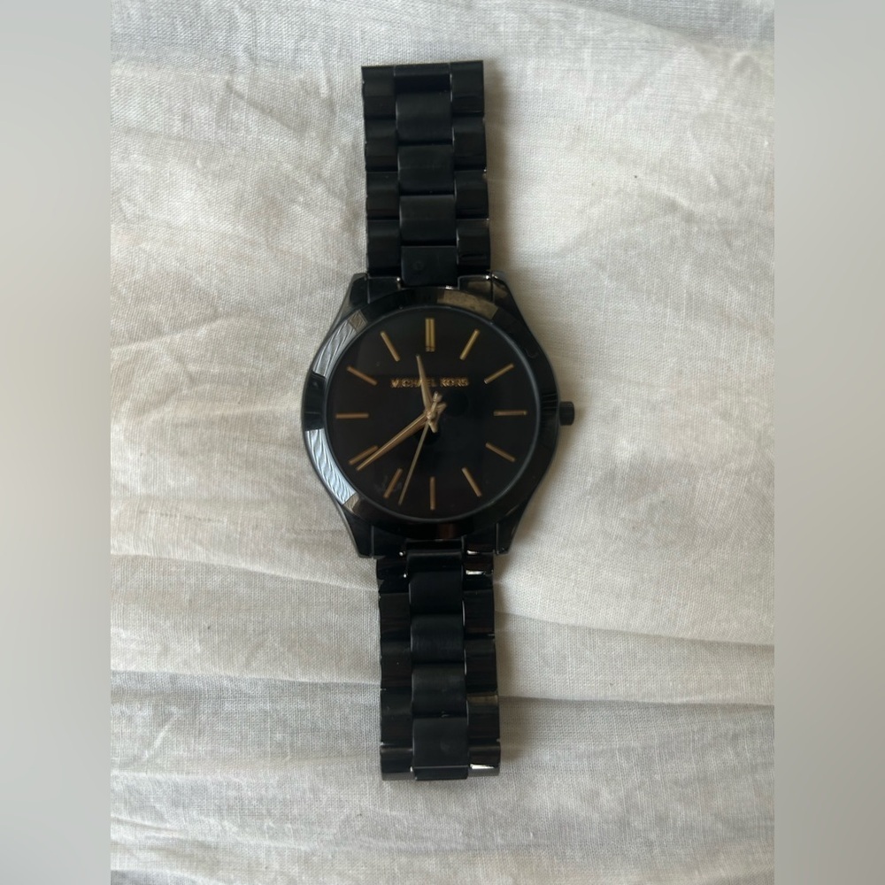 Michael Kors Black and Gold Watch It needs a battery replacement.
